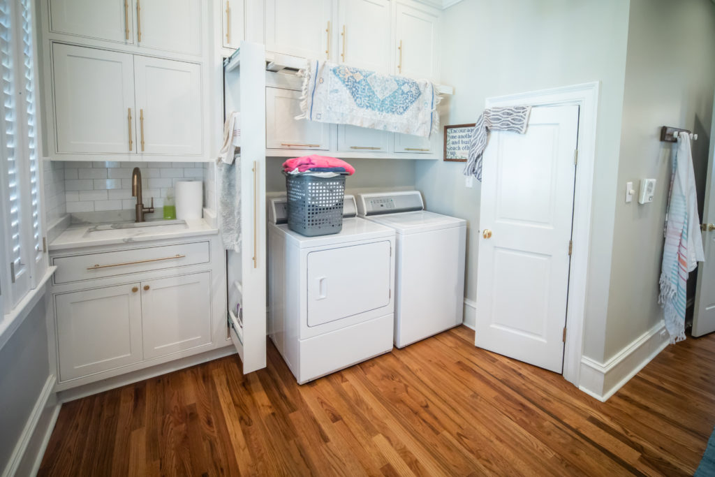 Laundry rooms (while not always as fancy as this stock photo!) are a huge draw for renters and buyers alike.