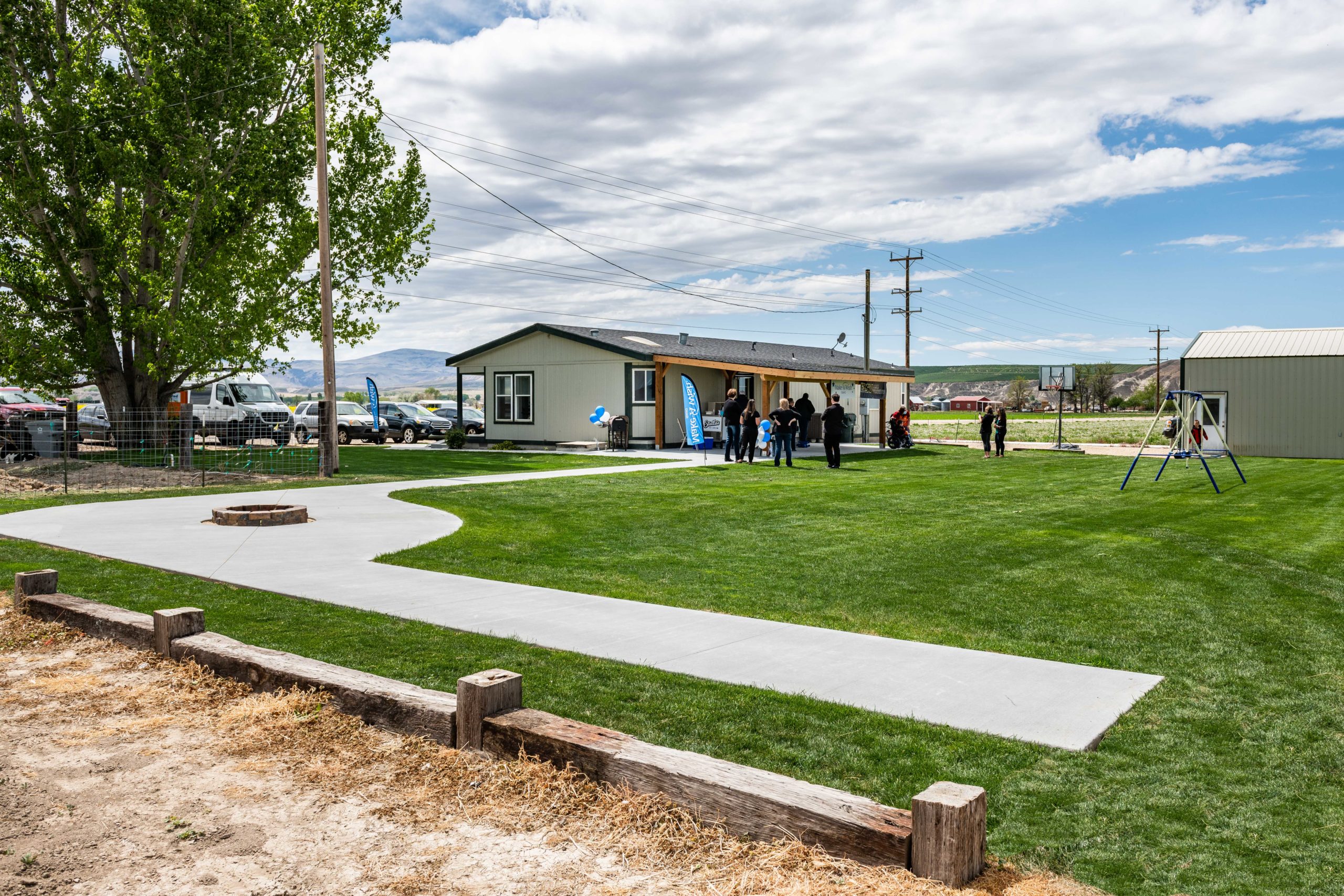 Image of ESI Cares and Make-a-Wish of Idaho's backyard renovation of the patio and fire pit.