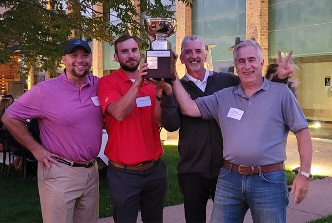 2022 HomeSphere Golf Tournament Cup Winners Hold Trophy