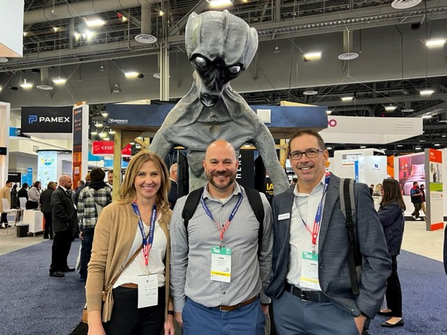 Katherine Dunton, Mike Rosenbach and Greg Schwarzer with the Alien in Greenheck's booth