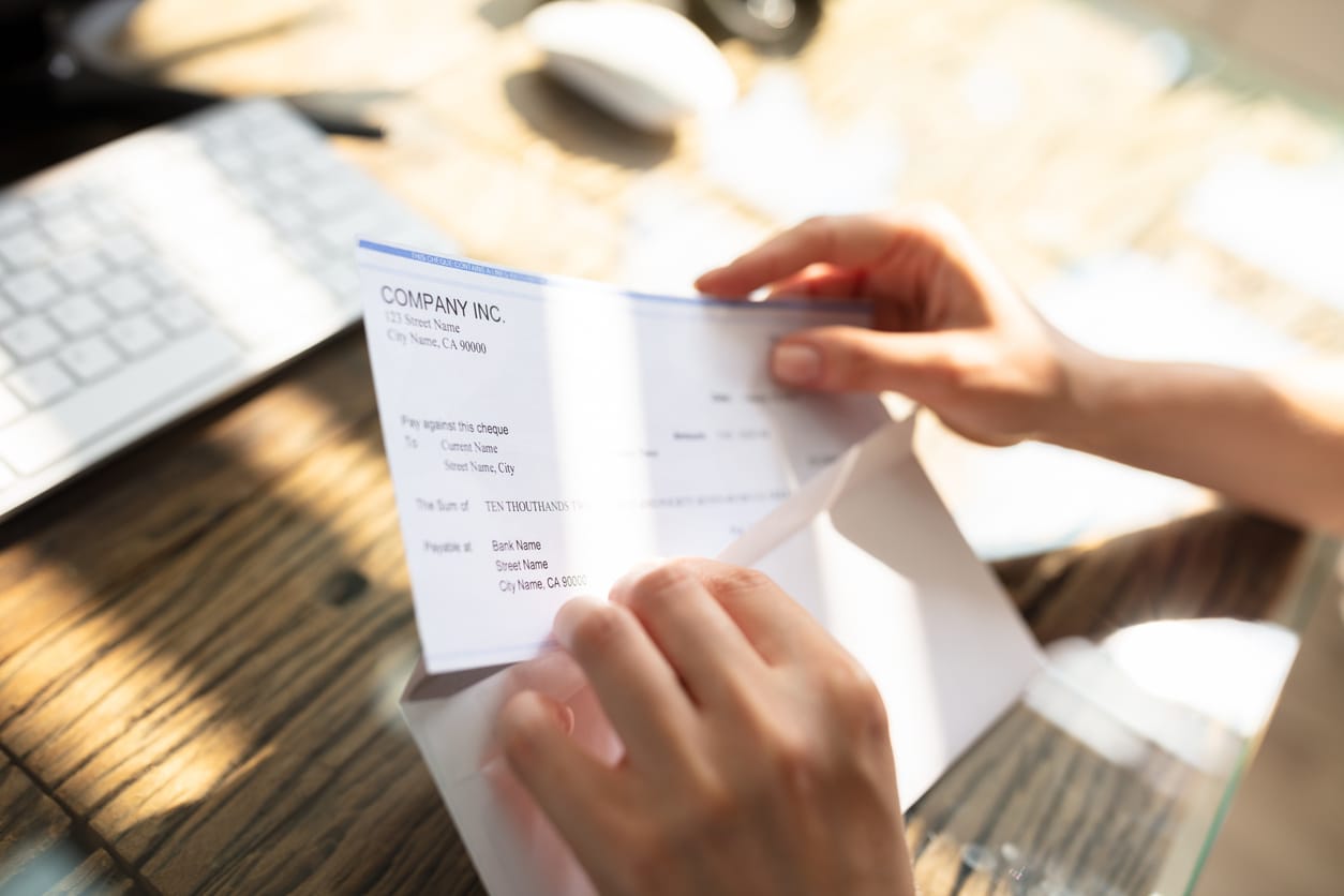 Contractor opening a rebate check
